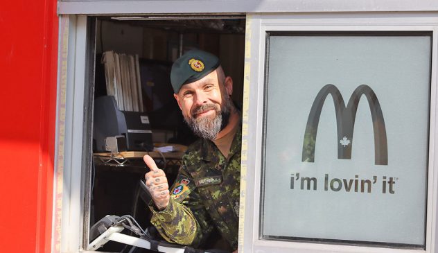 Acting Base Chief CWO Gauthier passed a crash course in McDonald’s training with flying colours. (Photo by: Emily Nakeff, Borden Citizen)